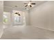 Open living area with high ceilings, neutral carpet, and decorative doorways at 29152 David Ct, Tavares, FL 32778