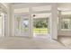 Open living area with access to screened porch, offering seamless indoor-outdoor living at 29152 David Ct, Tavares, FL 32778