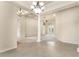 Spacious living area with tile flooring, decorative pillars, and natural light at 29152 David Ct, Tavares, FL 32778