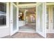 View from patio into home showcases open floor plan, including living and kitchen areas at 29152 David Ct, Tavares, FL 32778
