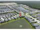 Aerial view of the community with lakes, streets, and the location of the home marked at 3021 King Palm Dr, New Smyrna Beach, FL 32168