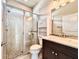 Bathroom featuring a glass enclosed shower with tile surround and a vanity with drawers at 3021 King Palm Dr, New Smyrna Beach, FL 32168