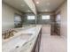 Contemporary bathroom featuring a marble countertop vanity and spacious walk-in shower at 3021 King Palm Dr, New Smyrna Beach, FL 32168