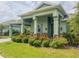 Charming home with lush landscaping, and a welcoming facade with brick accents at 3021 King Palm Dr, New Smyrna Beach, FL 32168
