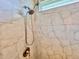 Shower with marble tile surround, dual shower heads and bronze fixtures at 3021 King Palm Dr, New Smyrna Beach, FL 32168