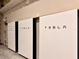 View of the Tesla batteries for home energy storage, mounted on a wall at 3021 King Palm Dr, New Smyrna Beach, FL 32168