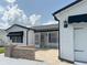Beautiful home exterior with awnings, a brick paved patio and attached garage at 3237 Atwell Ave, The Villages, FL 32162