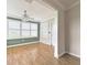 Bright living room featuring wood floors, natural light, and a modern ceiling fan at 3237 Atwell Ave, The Villages, FL 32162