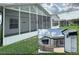 A bright and airy screened-in porch provides seamless indoor-outdoor living and picturesque neighborhood views at 3237 Atwell Ave, The Villages, FL 32162