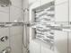 Detailed view of the bathroom shower featuring tile work and shower fixture at 3237 Atwell Ave, The Villages, FL 32162