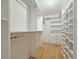 Well-organized walk-in closet with ample shelving, drawers, and hanging space at 3237 Atwell Ave, The Villages, FL 32162