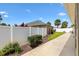 View of the backyard with a privacy fence and lush landscaping offering a serene outdoor space at 3331 Overland Ter, The Villages, FL 32163