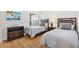 Comfortable bedroom with two twin beds, neutral bedding, matching nightstands, and a beachy theme at 3331 Overland Ter, The Villages, FL 32163