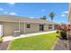 Exterior view of the house with a well-maintained lawn, plants, and a concrete walkway at 3331 Overland Ter, The Villages, FL 32163