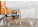 Bright kitchen with stainless steel appliances and granite countertops at 3331 Overland Ter, The Villages, FL 32163