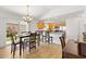 Open-concept kitchen, dining, with sliding glass doors to patio at 3331 Overland Ter, The Villages, FL 32163