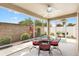 Screened patio with outdoor dining set, ceiling fan, and views of the landscaped backyard at 3331 Overland Ter, The Villages, FL 32163