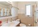 Cozy bathroom with a seashell-themed shower curtain and ample natural light at 38314 Echols Rd, Leesburg, FL 34788