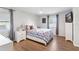 Inviting bedroom with a cozy quilt, fan, and natural light, perfect for relaxation at 38314 Echols Rd, Leesburg, FL 34788