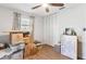 Charming bedroom with hardwood floors, a ceiling fan, and a closet, offering comfort and functionality at 38314 Echols Rd, Leesburg, FL 34788