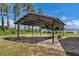 Large metal carport offers covered parking with lake views at 38314 Echols Rd, Leesburg, FL 34788