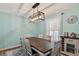 Charming dining room with a modern light fixture, wooden table with seating for six, and stylish decor at 38314 Echols Rd, Leesburg, FL 34788