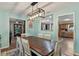Light and airy dining area features a view into the kitchen and is adjacent to the living room at 38314 Echols Rd, Leesburg, FL 34788