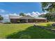 Classic brick home with well-maintained lawn, landscaping, and ample parking at 38314 Echols Rd, Leesburg, FL 34788