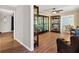 Inviting living room with hardwood floors and large display cabinets with glass at 38314 Echols Rd, Leesburg, FL 34788