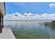 Breathtaking lake view with serene waters and a dock with metal ladder for easy access at 38314 Echols Rd, Leesburg, FL 34788