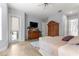 Bedroom featuring wood-look tile floors, a ceiling fan, and a door to the outside patio at 39145 Treeline Dr, Lady Lake, FL 32159