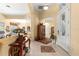 Welcoming foyer with tile flooring, stylish decor, and seamless transitions to living areas at 39145 Treeline Dr, Lady Lake, FL 32159