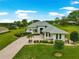 Beautiful home with a brick-paved driveway, lush landscaping, and well-maintained lawn at 39145 Treeline Dr, Lady Lake, FL 32159