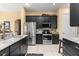 Well-equipped kitchen features stainless steel appliances and granite countertops at 39145 Treeline Dr, Lady Lake, FL 32159