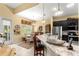Open kitchen with granite countertops, breakfast bar, and stainless steel appliances at 39145 Treeline Dr, Lady Lake, FL 32159