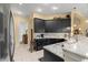 Open kitchen featuring dark cabinetry, granite countertops, and stainless steel appliances at 39145 Treeline Dr, Lady Lake, FL 32159
