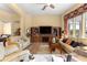 Inviting living room features a fireplace, built-in shelving, and comfortable seating at 39145 Treeline Dr, Lady Lake, FL 32159