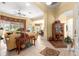 Open living area with tile flooring, a ceiling fan, and views to dining and other rooms at 39145 Treeline Dr, Lady Lake, FL 32159
