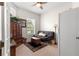 Bright office space with natural light, armoire, and a comfortable futon at 39145 Treeline Dr, Lady Lake, FL 32159