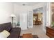 Cozy office area with a futon, a door leading to the living room at 39145 Treeline Dr, Lady Lake, FL 32159