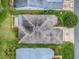 Overhead shot of a house with a roof, siding, and lawn, highlighting its location and structure at 409 Westwood Dr, Leesburg, FL 34748