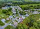 Aerial view showing the property's location in a residential community with mature trees at 409 Westwood Dr, Leesburg, FL 34748