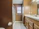 This bathroom features a shower, toilet, and a vanity at 409 Westwood Dr, Leesburg, FL 34748