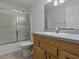This bathroom features a shower, toilet, and a vanity at 409 Westwood Dr, Leesburg, FL 34748