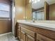 This bathroom features a shower, toilet, and a vanity at 409 Westwood Dr, Leesburg, FL 34748