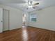 This bedroom offers wood floors and an ensuite bathroom at 409 Westwood Dr, Leesburg, FL 34748