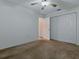 This bedroom offers carpet floors, a closet, and neutral walls at 409 Westwood Dr, Leesburg, FL 34748