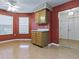 Charming breakfast area with bright windows and stylish ceiling fan and lighting at 409 Westwood Dr, Leesburg, FL 34748