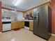 Well-equipped kitchen with stainless steel appliances and plenty of counter space at 409 Westwood Dr, Leesburg, FL 34748