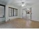 Sunroom with tile floor features a sliding glass door at 409 Westwood Dr, Leesburg, FL 34748